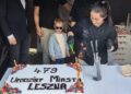 Child Wearing Blue Sunglasses Watches As a Chef in Black Oversees a Flaming Dessert Cake Decorated with Strawberries and Blueberries at a City Birthday Event 13 Czerwca 2020 