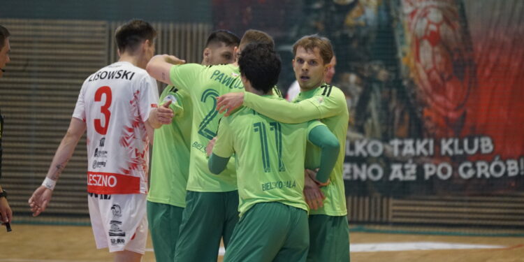 Team of Players in Lime Green Uniforms Hug on an Indoor Court Celebrating During a Match White Jersey with Number 3 Visible on Left 10 Maja 2026 