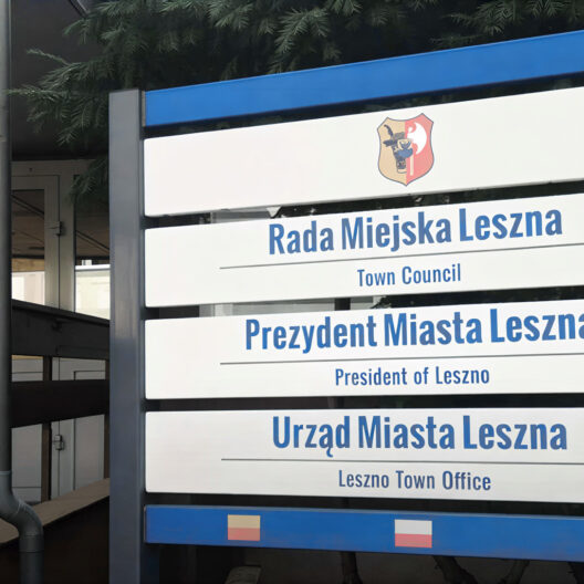 Sign for Rada Miejska Leszna town Council and Prezydent Miasta Leszna president of Leszno with a Crest on a Blue framed Outdoor Sign 9 Września 2025