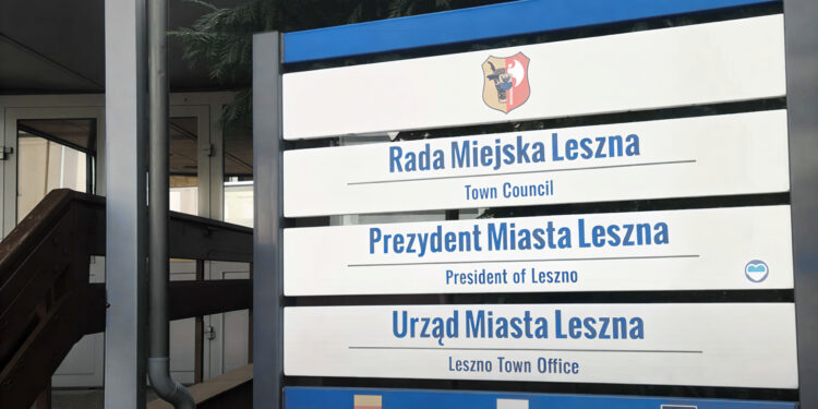 Sign for Rada Miejska Leszna town Council and Prezydent Miasta Leszna president of Leszno with a Crest on a Blue framed Outdoor Sign 9 Czerwca 2026